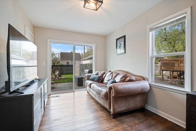 interior space featuring baseboards and hardwood / wood-style flooring
