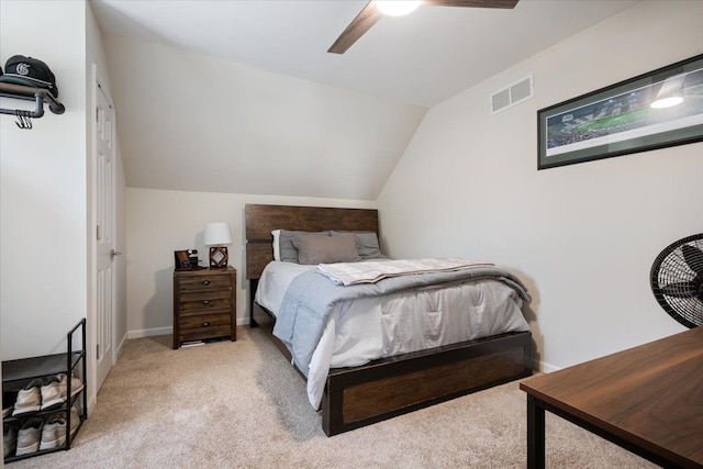 bedroom featuring carpet floors, a ceiling fan, visible vents, and lofted ceiling