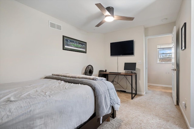 bedroom with visible vents, baseboards, ceiling fan, and light carpet