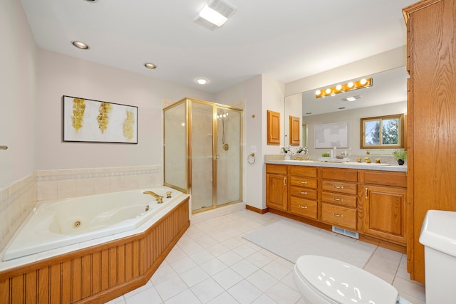 bathroom with tile patterned flooring, double vanity, toilet, a tub with jets, and a stall shower