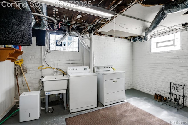 879 Lawrence St, Detroit, MI 48202 - washroom featuring independent washer and dryer and brick wall