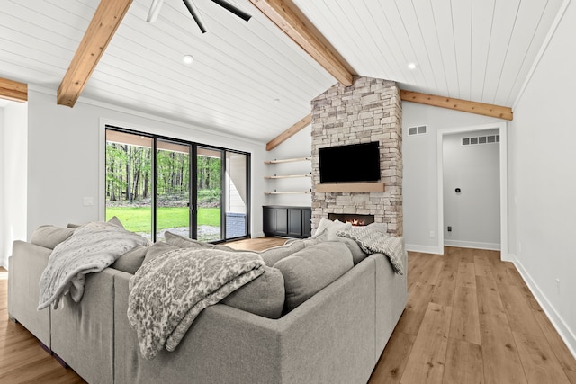 living area featuring light wood finished floors, a stone fireplace, baseboards, a ceiling fan, and recessed lighting