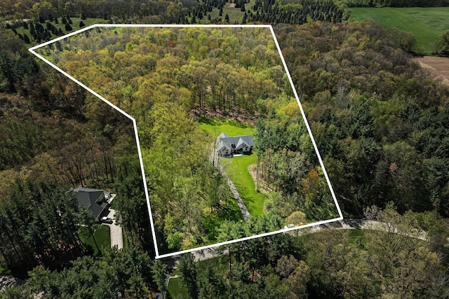 view of property location featuring a forest and property boundaries highlighted