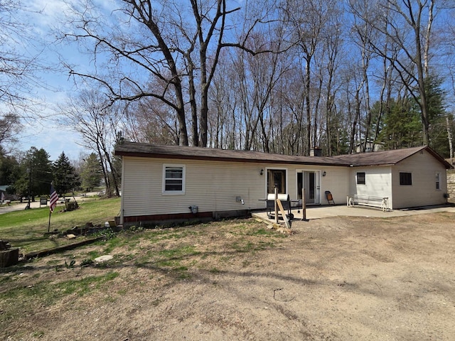 4280 Birch St, Lake, MI 48632 - view of front of property featuring a patio and a chimney