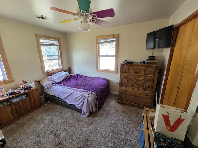 4280 Birch St, Lake, MI 48632 - carpeted bedroom featuring multiple windows and ceiling fan