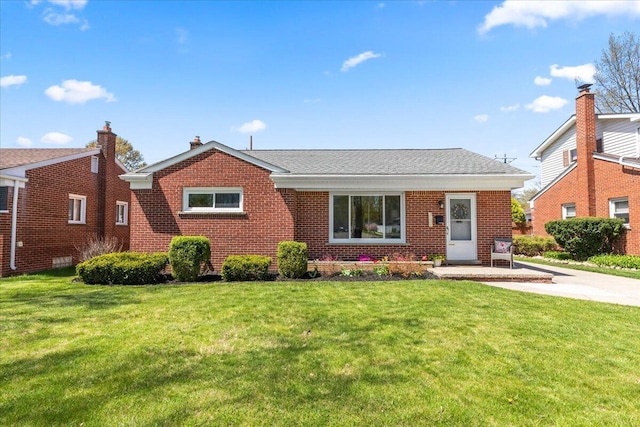 single story home featuring a front lawn and brick siding