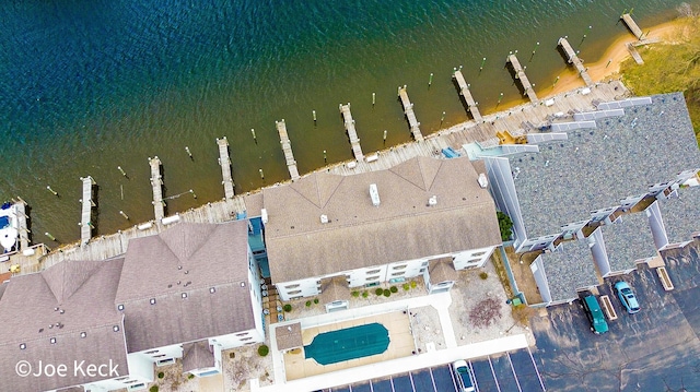 317 5th Ave Unit 7, Manistee, MI 49660 - aerial overview of property's location featuring a nearby body of water