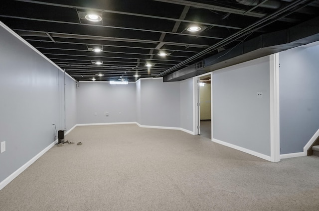 finished below grade area featuring carpet floors and baseboards