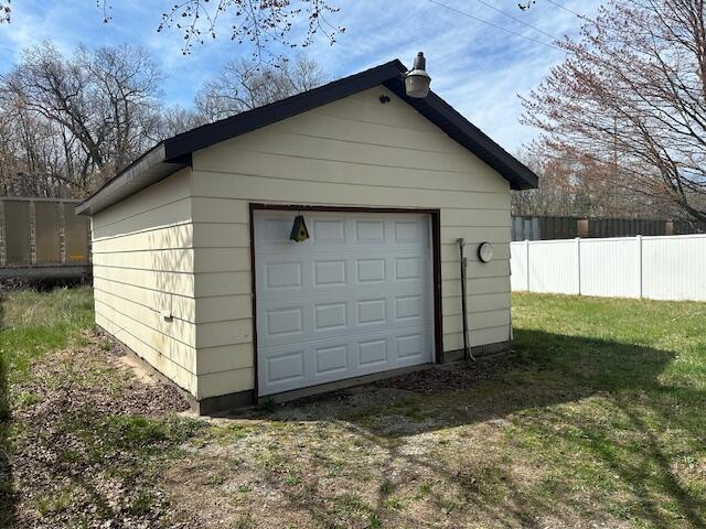 detached garage with fence