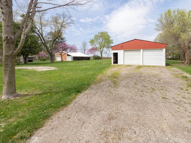 detached garage featuring driveway