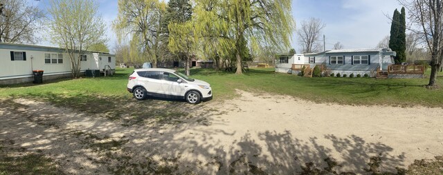 view of yard featuring a wooden deck