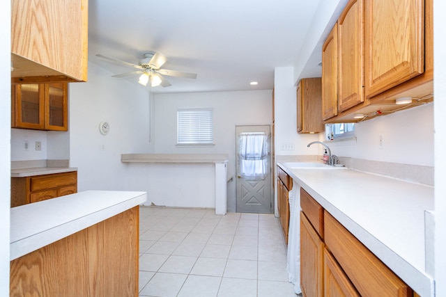 kitchen with a ceiling fan, recessed lighting, light countertops, a sink, and light tile patterned floors