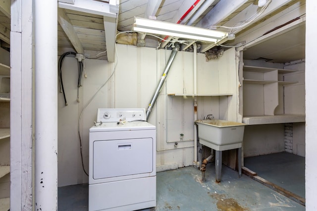 clothes washing area featuring washer / dryer and laundry area