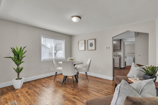 2040 Freeman St, Westland, MI 48186 - dining area featuring baseboards, visible vents, and wood finished floors