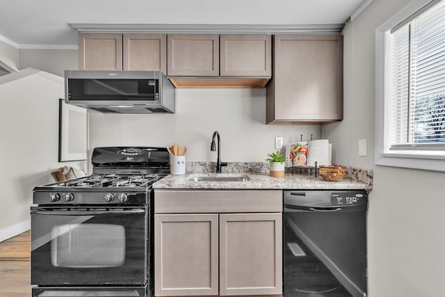 2040 Freeman St, Westland, MI 48186 - kitchen featuring ornamental molding, wood finished floors, light stone countertops, a sink, and black appliances