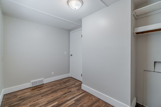 2040 Freeman St, Westland, MI 48186 - unfurnished room featuring visible vents, dark wood finished floors, and baseboards