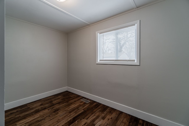 2040 Freeman St, Westland, MI 48186 - spare room featuring baseboards, dark wood-type flooring, and visible vents