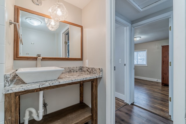 2040 Freeman St, Westland, MI 48186 - bathroom with baseboards, wood finished floors, and vanity