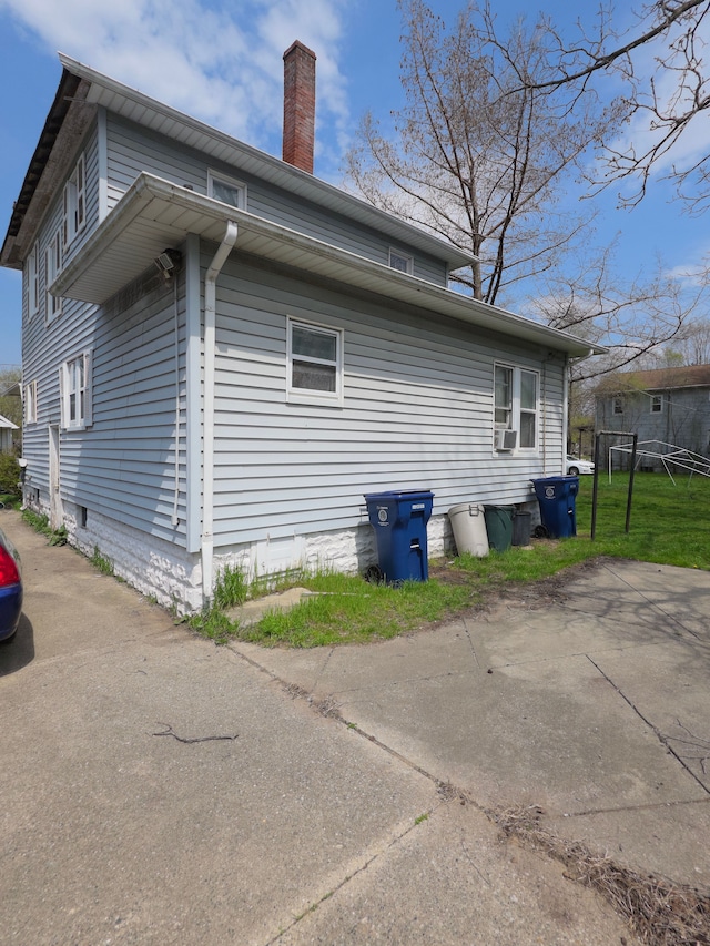 132 E Lakeview Ave, Flint, MI 48503 - view of home's exterior featuring a chimney