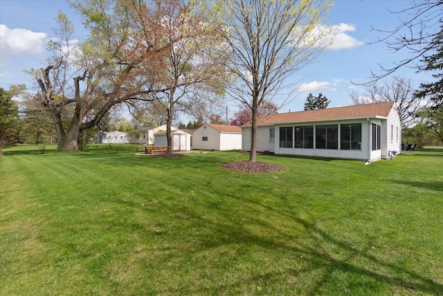 view of yard with a storage shed and an outdoor structure