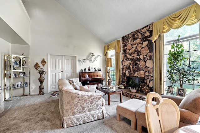 carpeted living area featuring baseboards, a high ceiling, and a fireplace