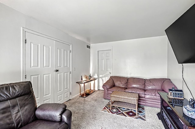 living room featuring carpet floors and visible vents