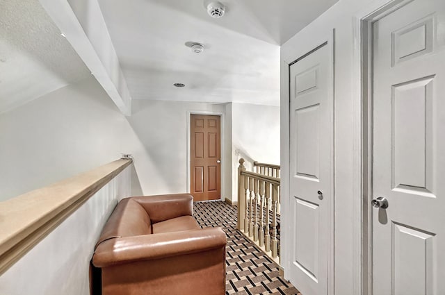 corridor featuring an upstairs landing