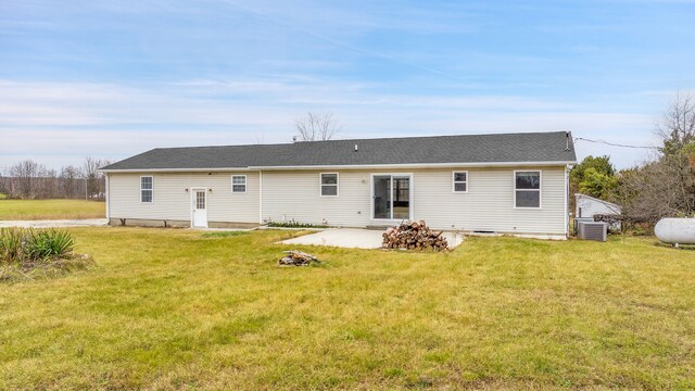 back of house with a patio, central AC unit, and a yard