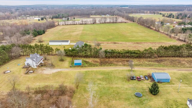 birds eye view of property featuring a rural view