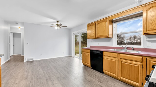 kitchen with visible vents, a ceiling fan, light wood-style floors, a sink, and dishwasher
