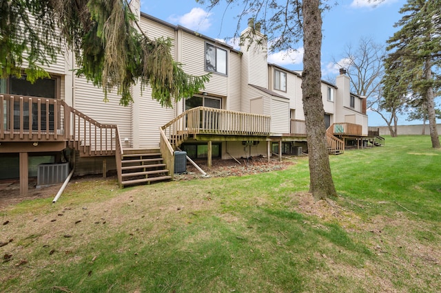 back of house with stairs, a lawn, a deck, and cooling unit