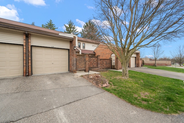 view of front of property with fence, a front yard, and brick siding