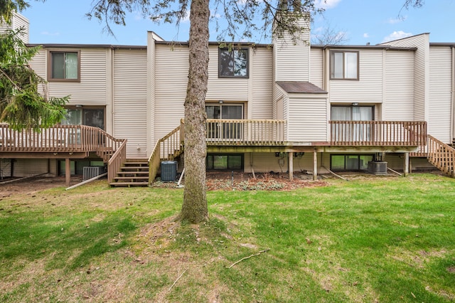 back of house with cooling unit, a wooden deck, and stairs