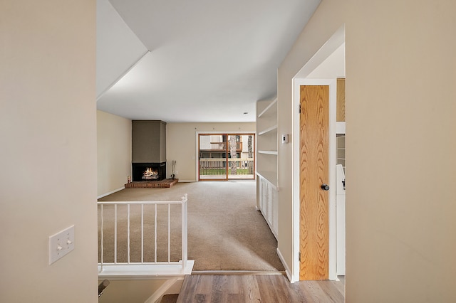 hall with wood finished floors