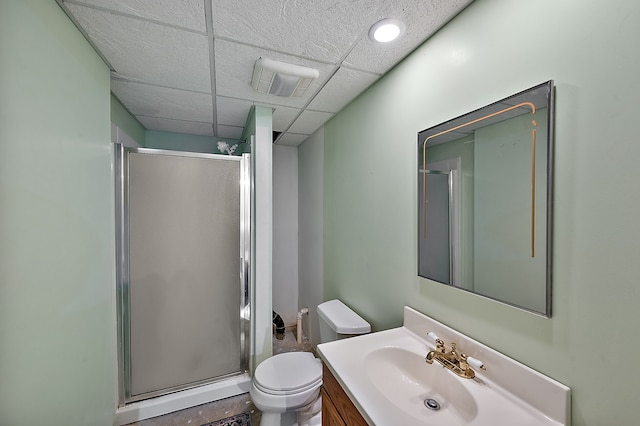 full bath featuring vanity, a stall shower, toilet, and visible vents