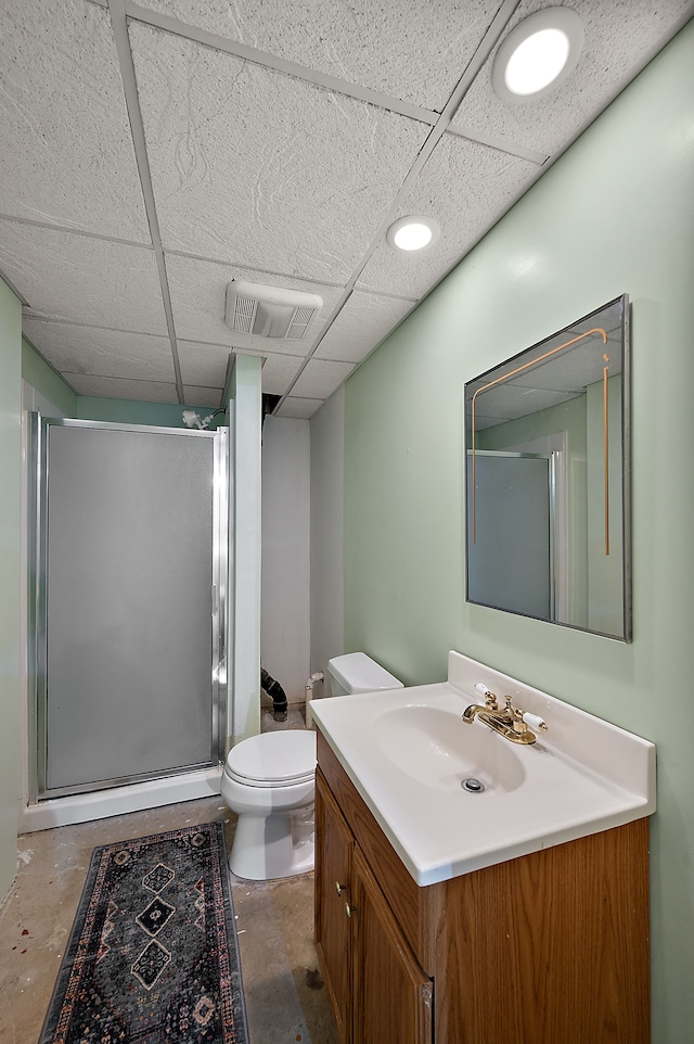 bathroom with visible vents, vanity, toilet, concrete floors, and a stall shower
