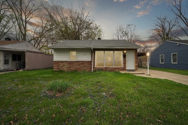 exterior space featuring an outbuilding and a yard