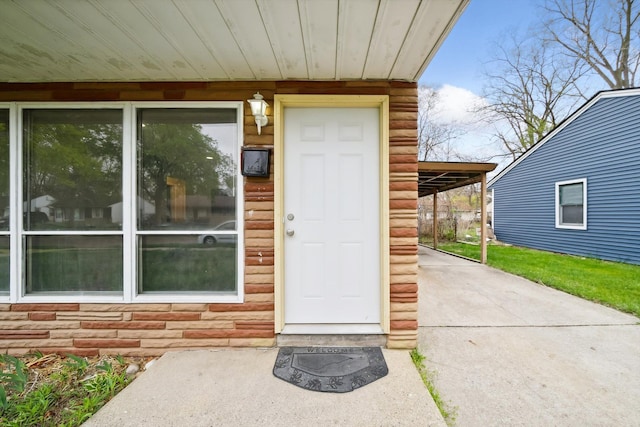 view of exterior entry with stone siding