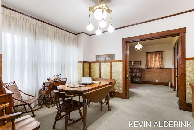 201 N Woodworth St, Corunna, MI 48817 - dining space with light carpet, ornamental molding, and a wainscoted wall
