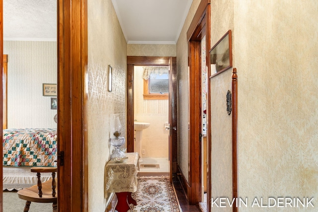 201 N Woodworth St, Corunna, MI 48817 - hallway with crown molding and wallpapered walls
