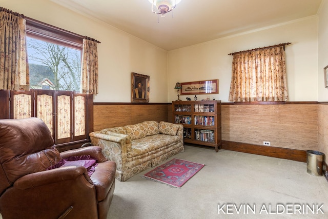201 N Woodworth St, Corunna, MI 48817 - living area featuring carpet, wainscoting, and ornamental molding