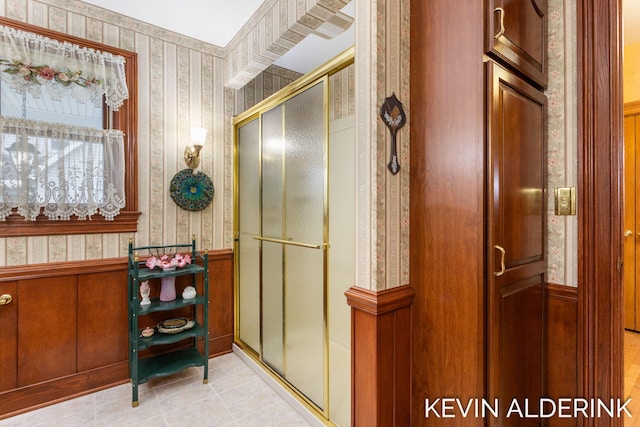 201 N Woodworth St, Corunna, MI 48817 - full bath featuring wallpapered walls, a stall shower, wainscoting, and tile patterned floors