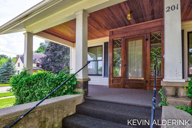 201 N Woodworth St, Corunna, MI 48817 - property entrance with a porch