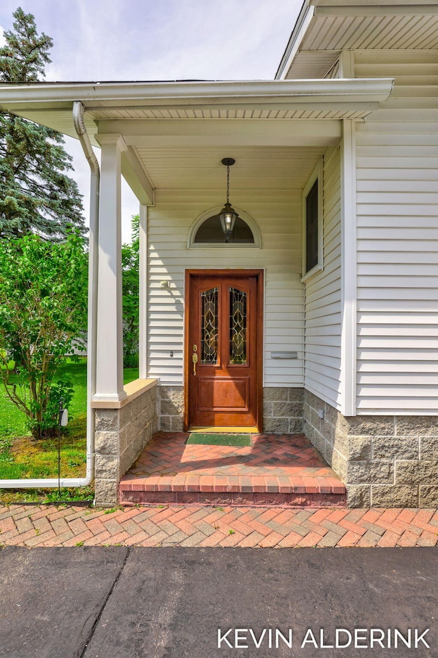 201 N Woodworth St, Corunna, MI 48817 - view of exterior entry featuring a porch