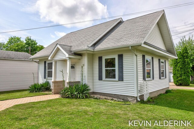 201 N Woodworth St, Corunna, MI 48817 - view of front of home with a front lawn and a shingled roof