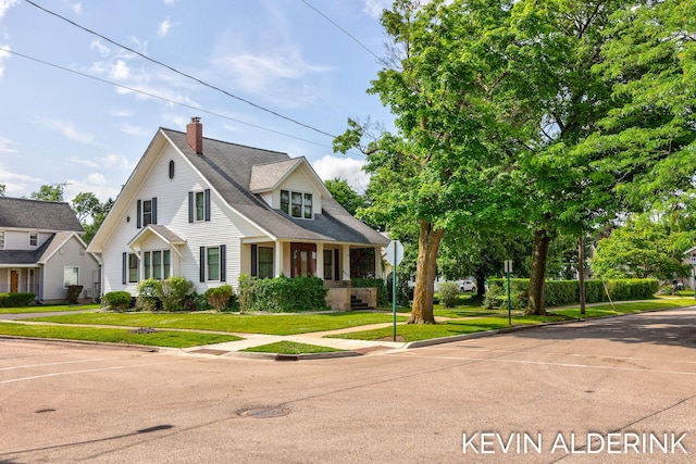 201 N Woodworth St, Corunna, MI 48817 - view of front of house featuring a chimney and a front lawn