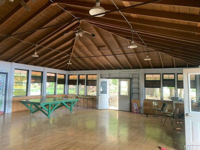 unfurnished sunroom with beamed ceiling