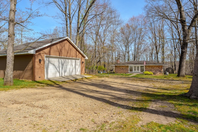 detached garage featuring french doors