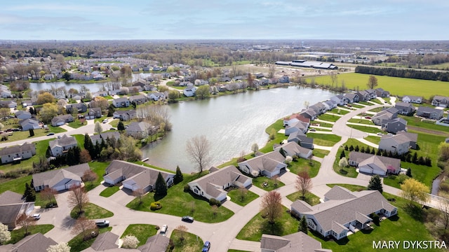 bird's eye view featuring a residential view and a water view