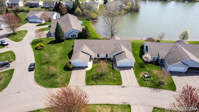 bird's eye view with a water view and a residential view